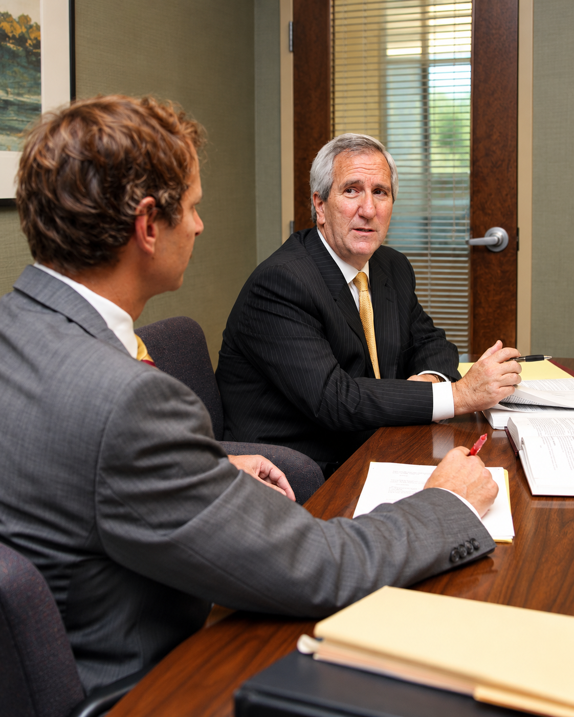 Harry Baumohl and Michael Hamburg discussing a divorce case in Anne Arundel County